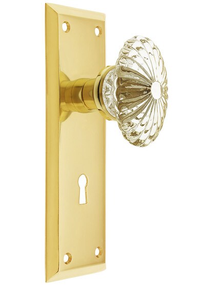 New York Plate with Oval Fluted Crystal Knob with Keyhole in Polished Brass.